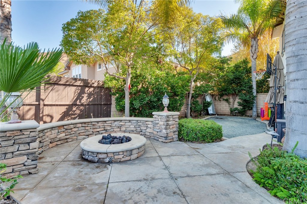 2470 Bulrush Circle Corona, CA 92882 - Photo 51 of 64 a view of a chair and table in the backyard
