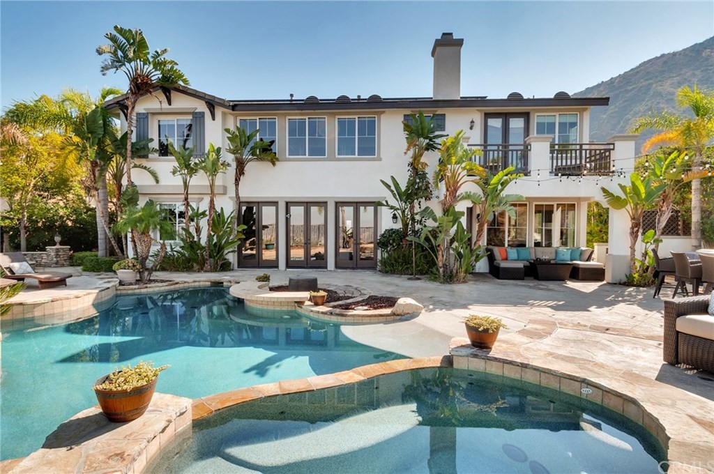 2470 Bulrush Circle Corona, CA 92882 - Photo 58 of 64 a front view of a house with swimming pool garden and patio