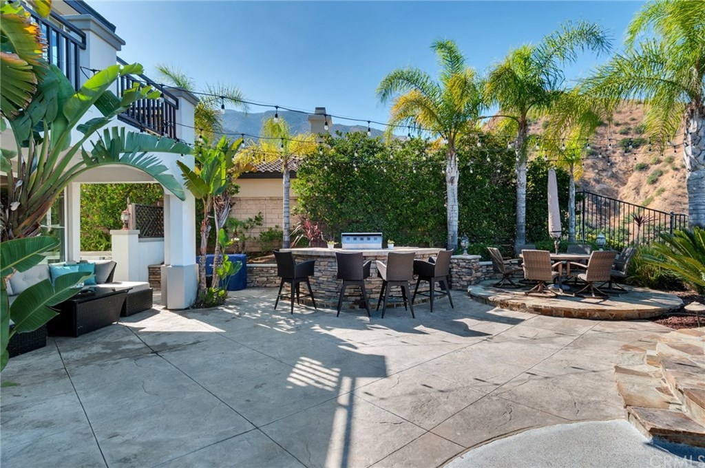 2470 Bulrush Circle Corona, CA 92882 - Photo 59 of 64 a view of a patio with chairs and potted plants