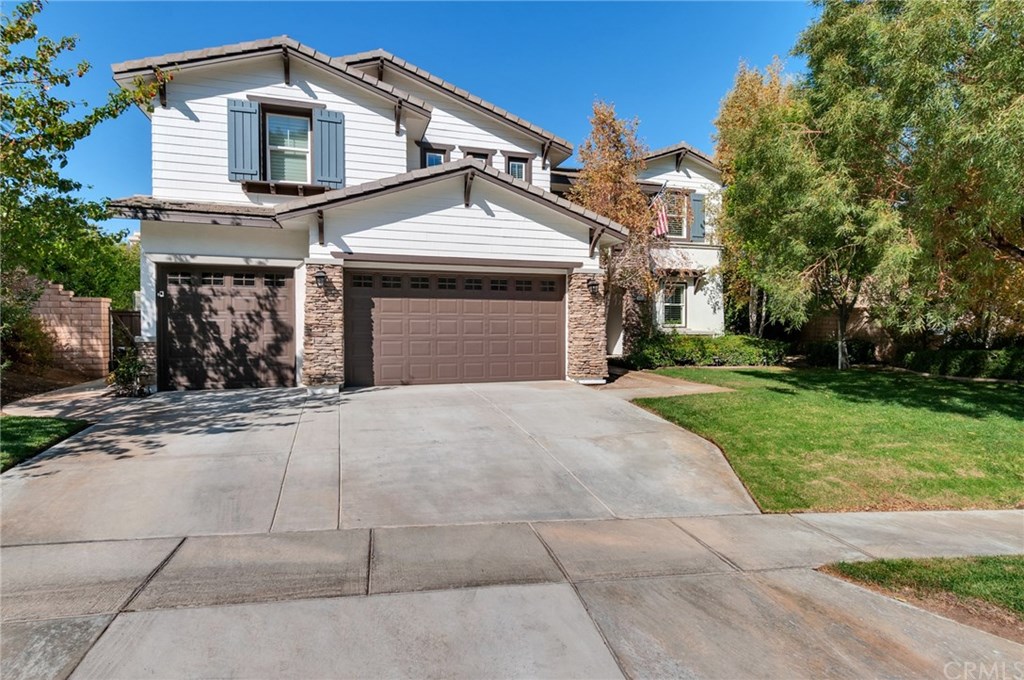 2470 Bulrush Circle Corona, CA 92882 - Photo 60 of 64 front view of a house with a yard