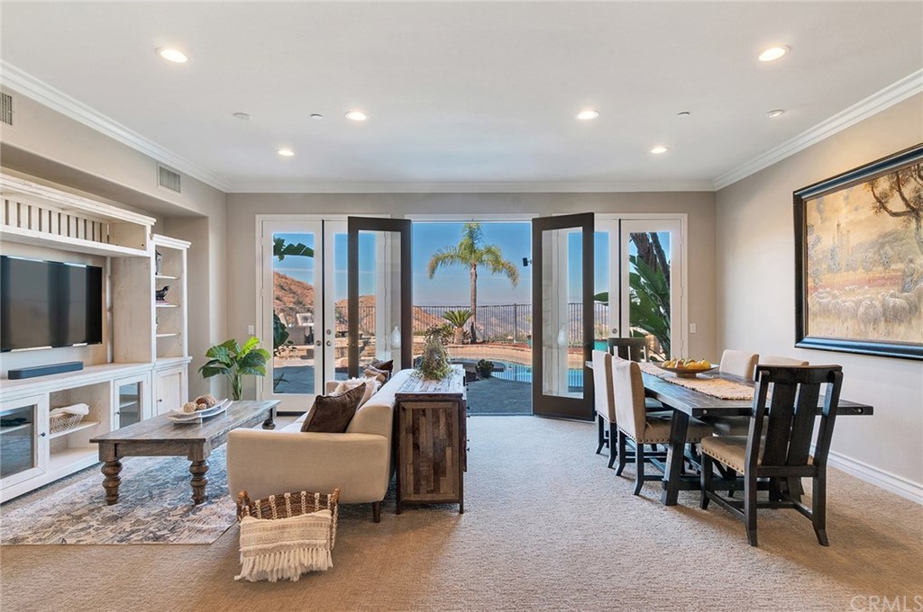 2470 Bulrush Circle Corona, CA 92882 - Photo 10 of 64 a living room with furniture and large windows