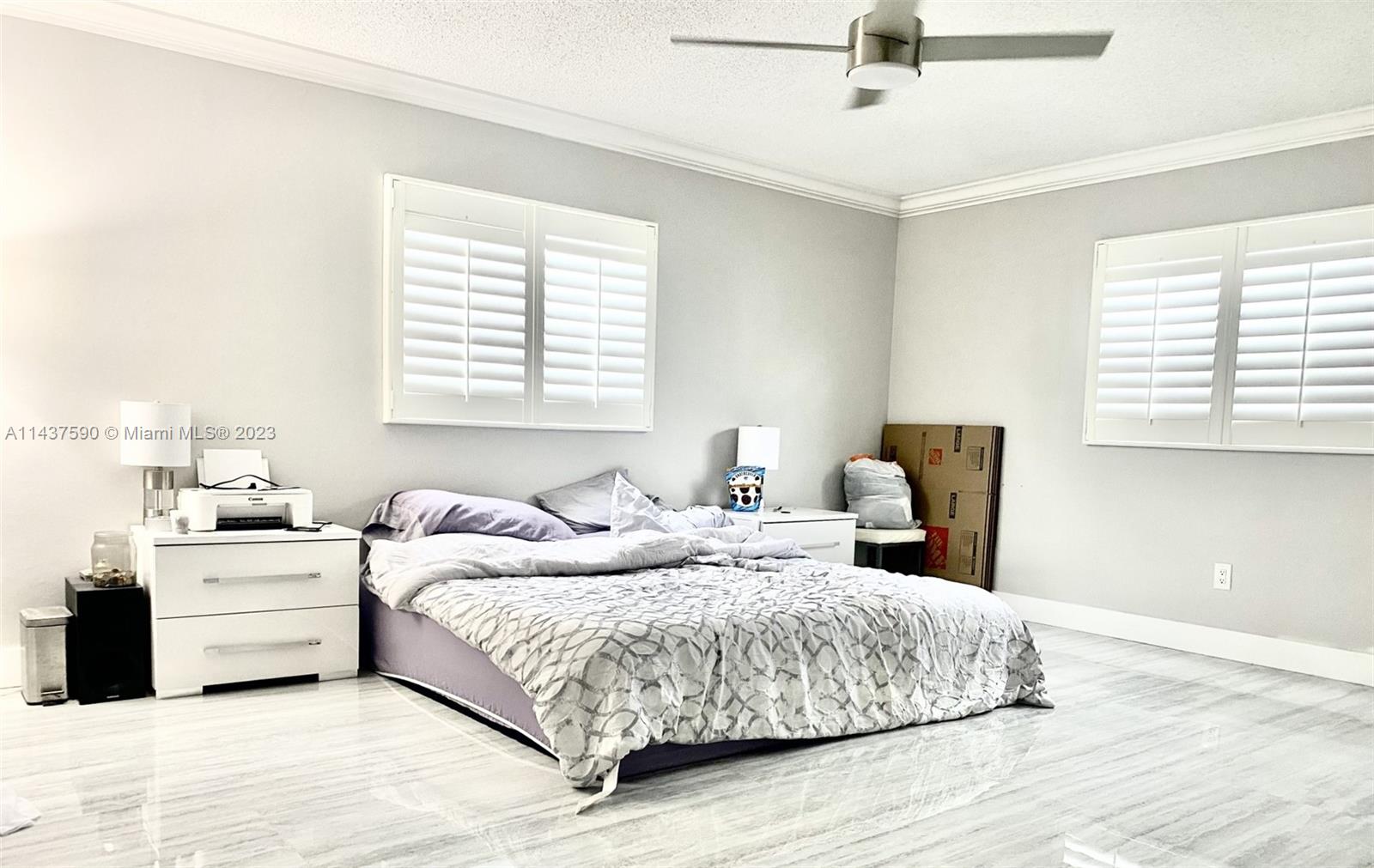 22620 Southwest 65th Way Boca Raton, FL 33428 - Photo 14 of 23 a bedroom with a large bed and a window
