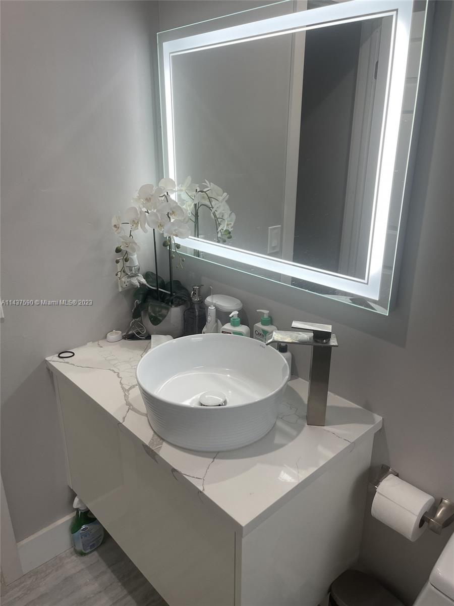 22620 Southwest 65th Way Boca Raton, FL 33428 - Photo 19 of 23 a bathroom with a sink and a mirror
