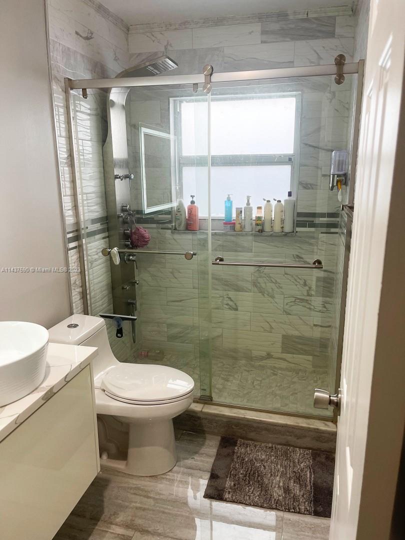 22620 Southwest 65th Way Boca Raton, FL 33428 - Photo 21 of 23 a bathroom with a sink toilet and shower