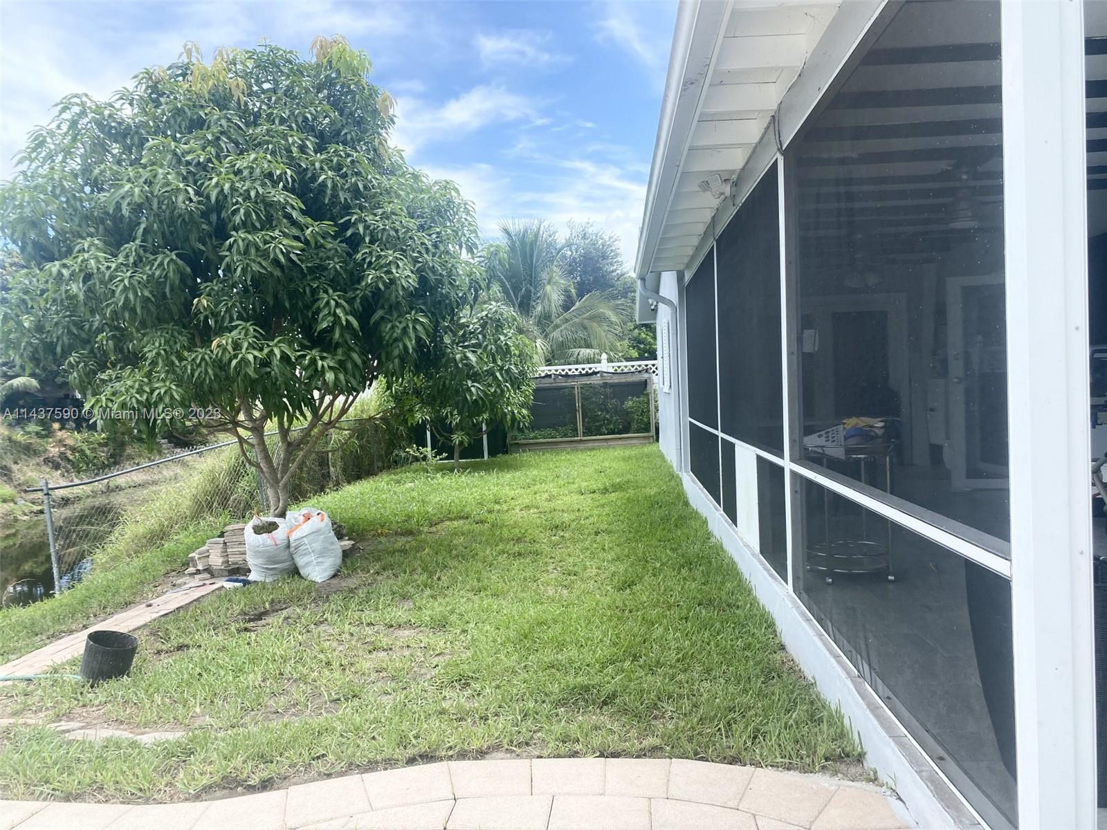 22620 Southwest 65th Way Boca Raton, FL 33428 - Photo 22 of 23 a view of a backyard with garden