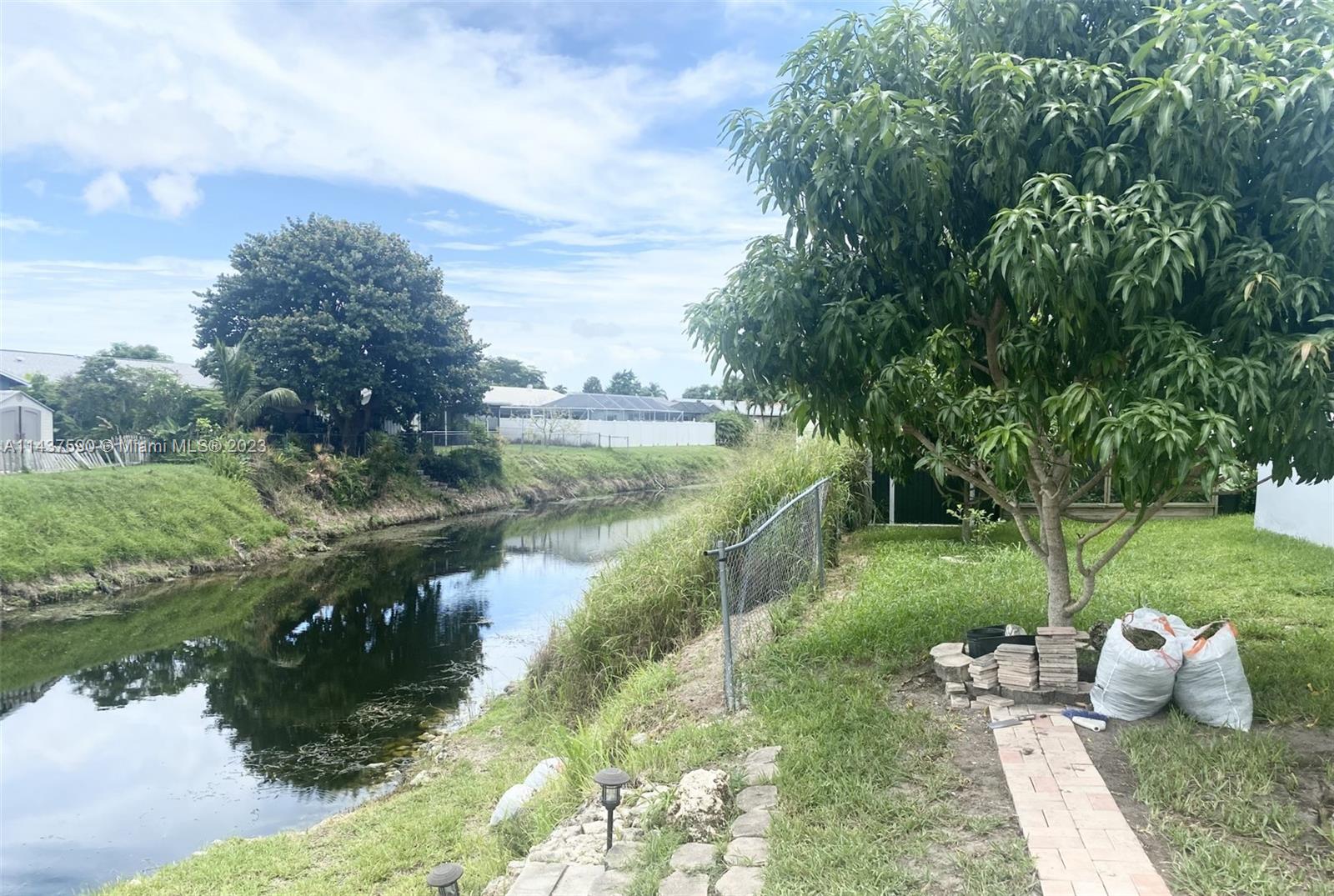 22620 Southwest 65th Way Boca Raton, FL 33428 - Photo 4 of 23 a view of a lake from a yard