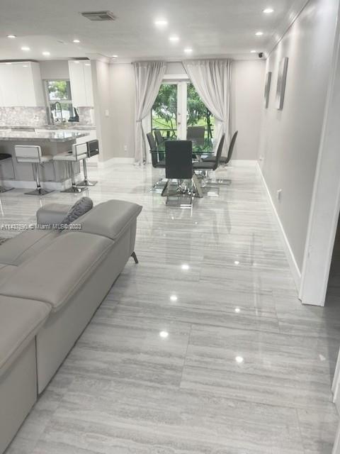 22620 Southwest 65th Way Boca Raton, FL 33428 - Photo 7 of 23 a living room with furniture and a mirror