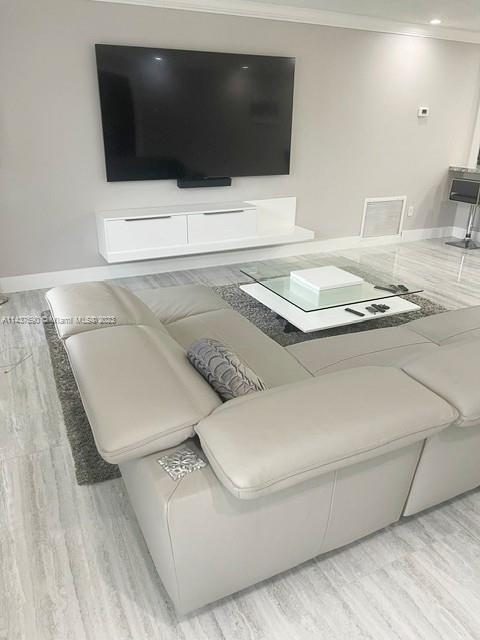 22620 Southwest 65th Way Boca Raton, FL 33428 - Photo 9 of 23 a living room with a rug and a couch