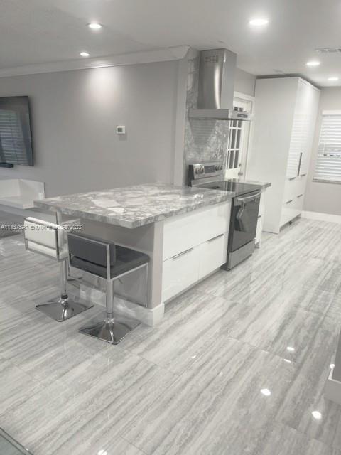22620 Southwest 65th Way Boca Raton, FL 33428 - Photo 10 of 23 a kitchen with stainless steel appliances granite countertop a stove a sink and a refrigerator