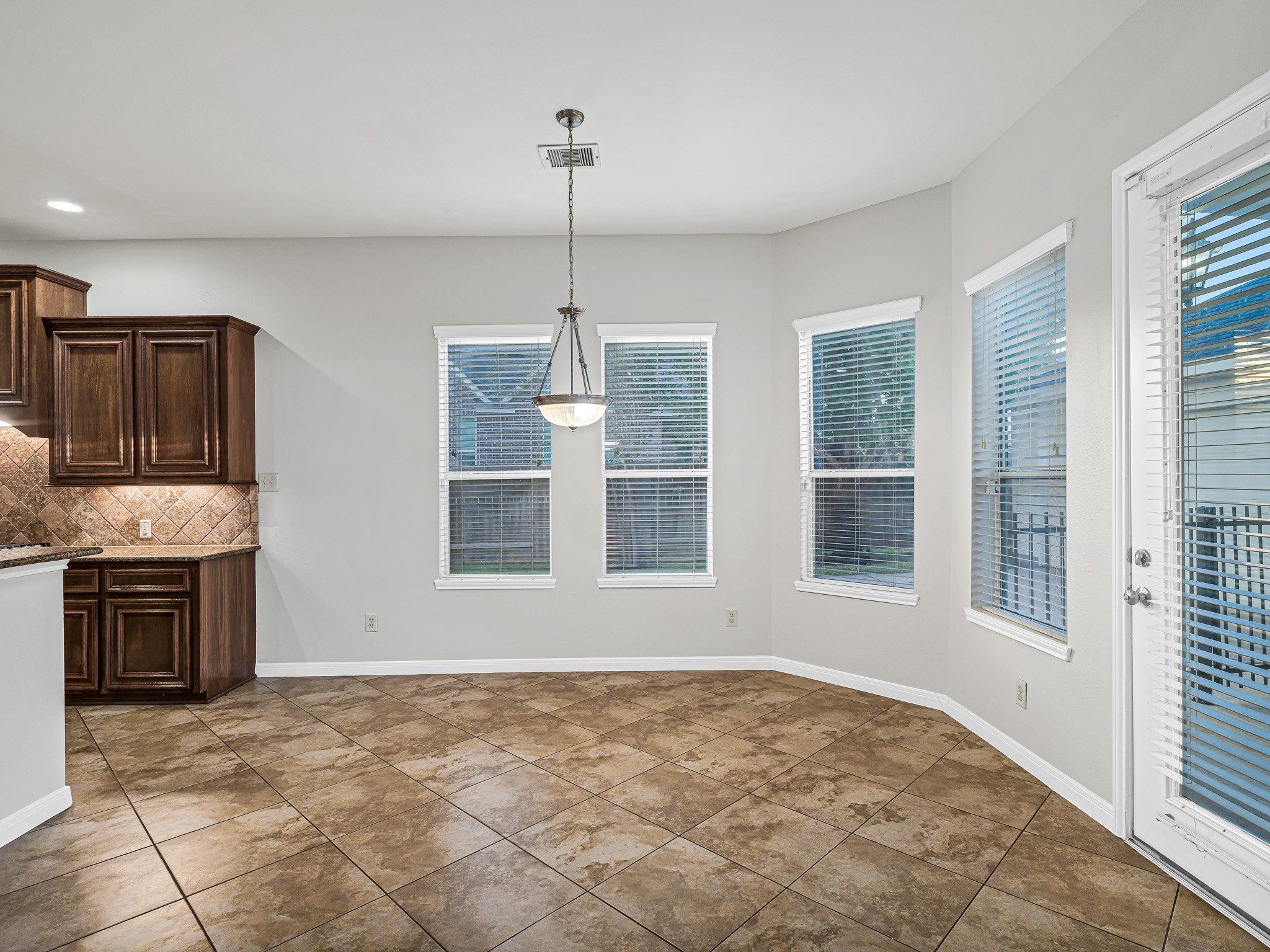 2714 Misty River Lane Richmond, TX 77406 - Photo 17 of 50 a view of an empty room with a kitchen