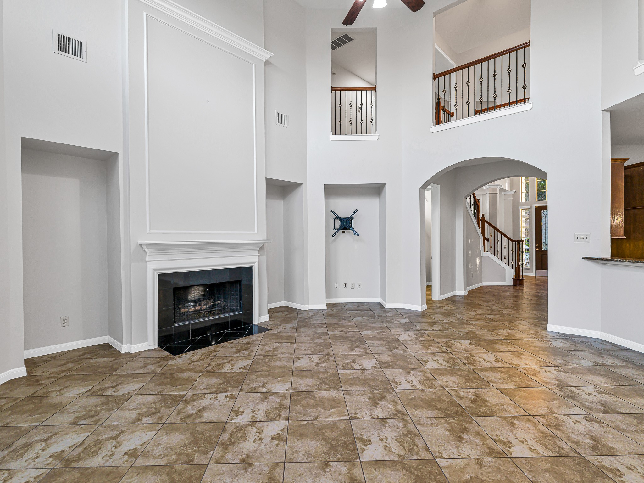 2714 Misty River Lane Richmond, TX 77406 - Photo 20 of 50 a view of empty room with a fireplace and entryway