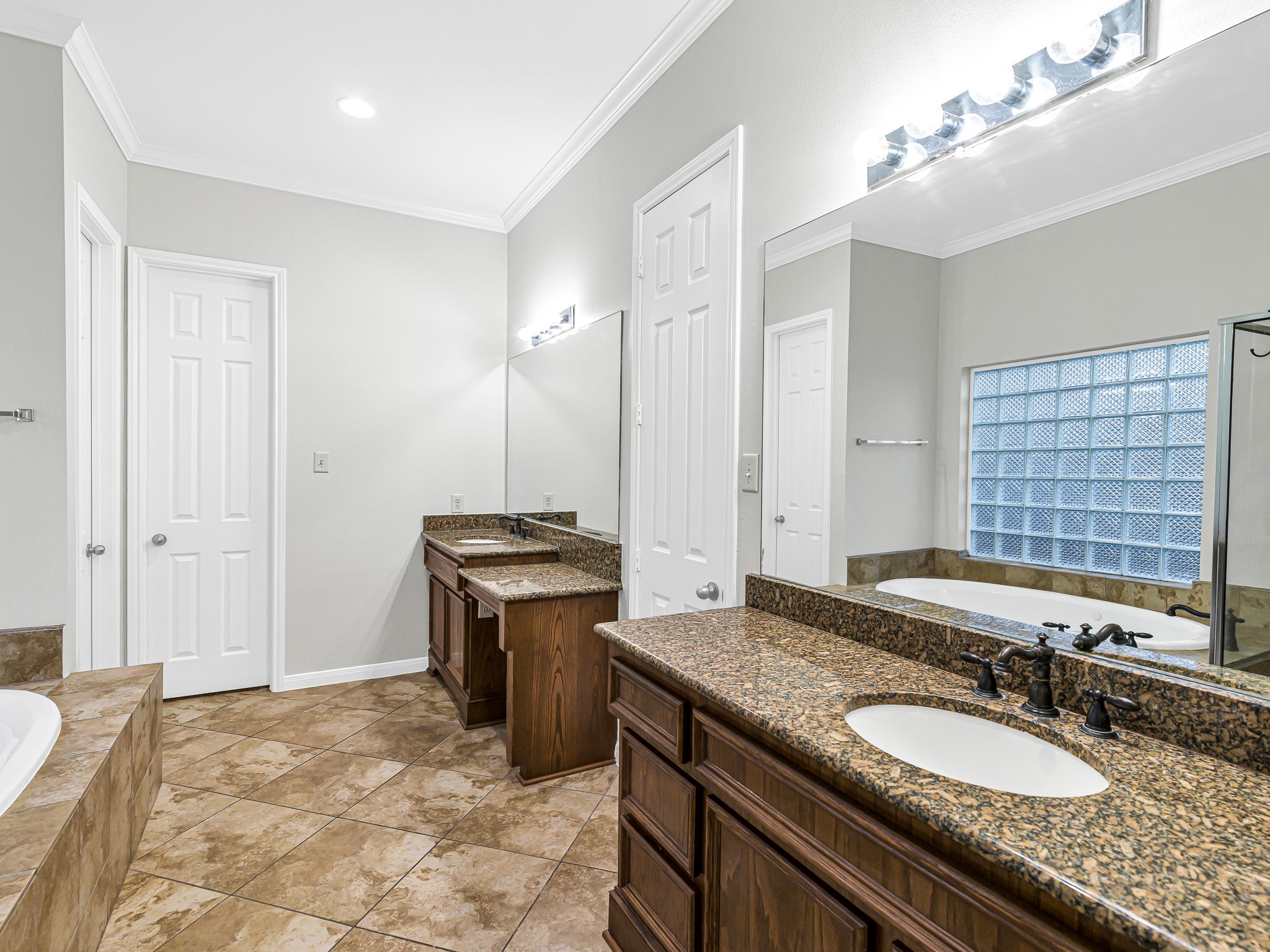 2714 Misty River Lane Richmond, TX 77406 - Photo 25 of 50 a bathroom with a granite countertop sink a toilet and a mirror