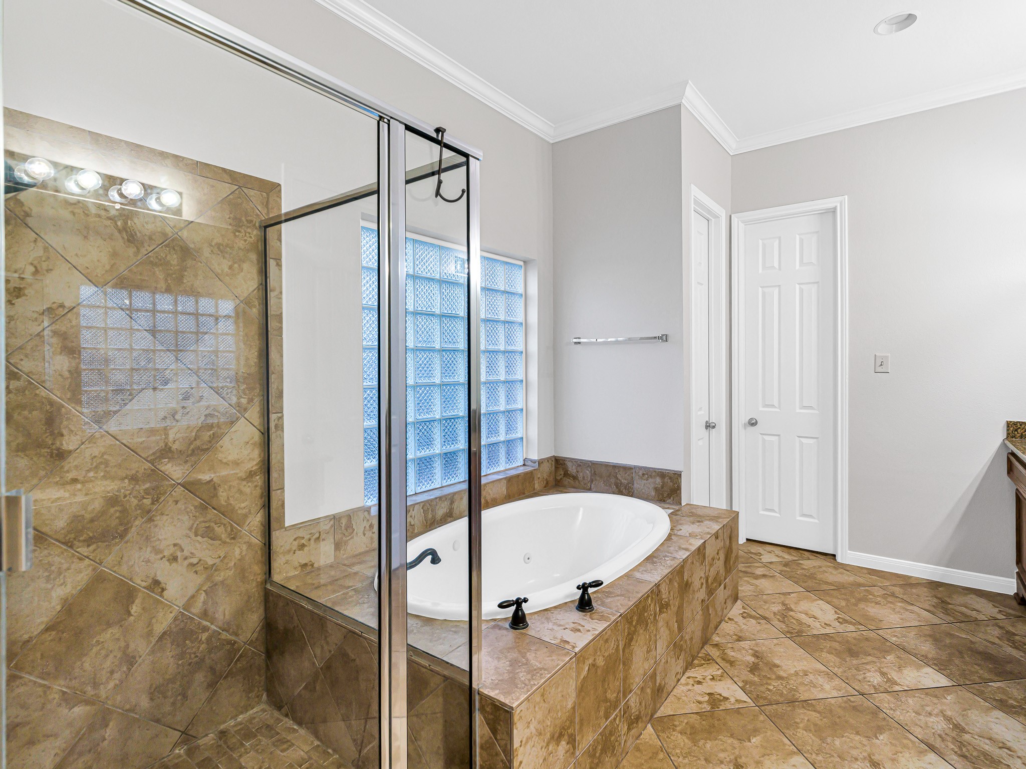 2714 Misty River Lane Richmond, TX 77406 - Photo 26 of 50 a bathroom with a tub and shower