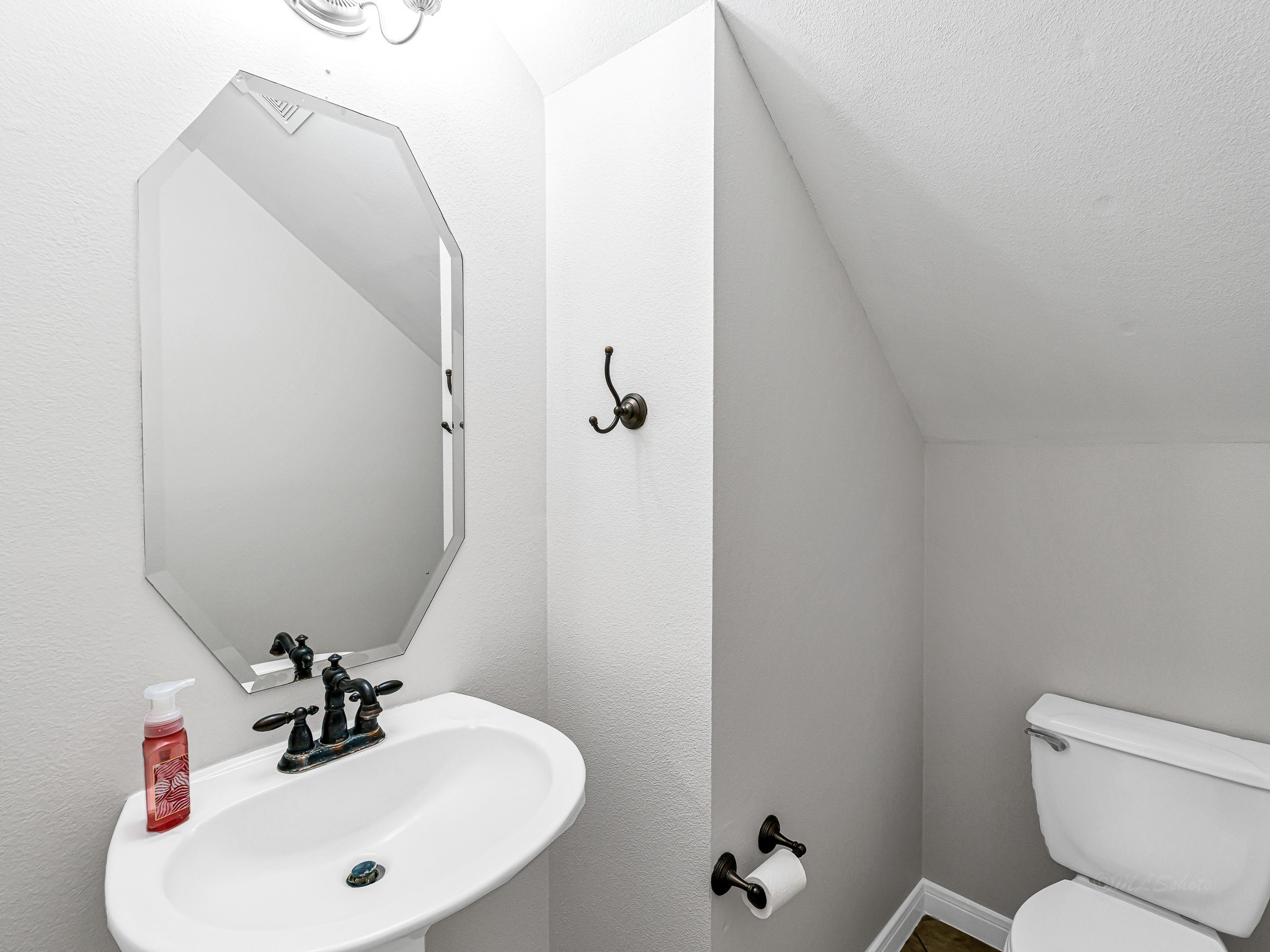 2714 Misty River Lane Richmond, TX 77406 - Photo 29 of 50 a bathroom with a sink mirror and toilet