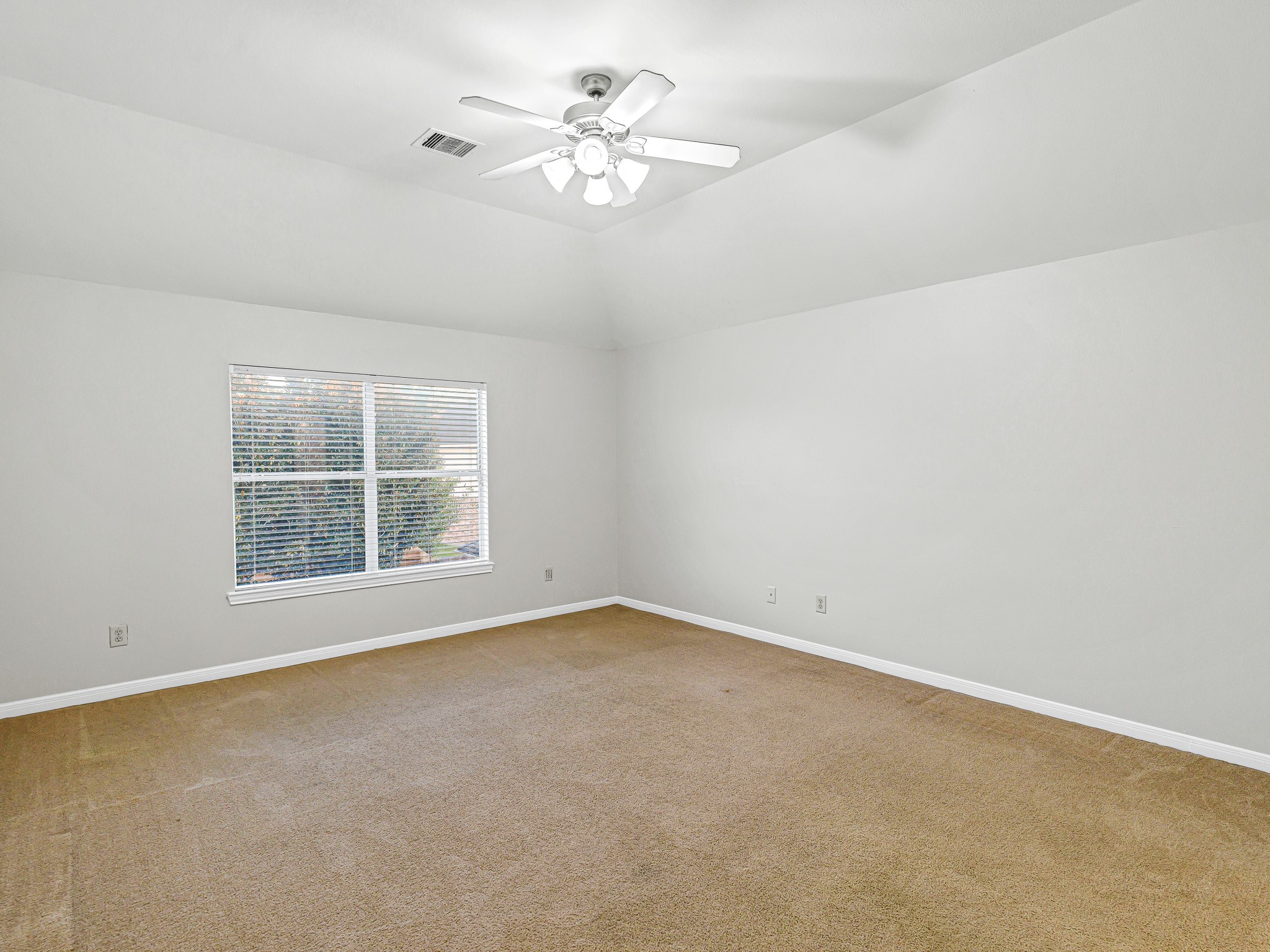 2714 Misty River Lane Richmond, TX 77406 - Photo 34 of 50 an empty room with a window and a fan