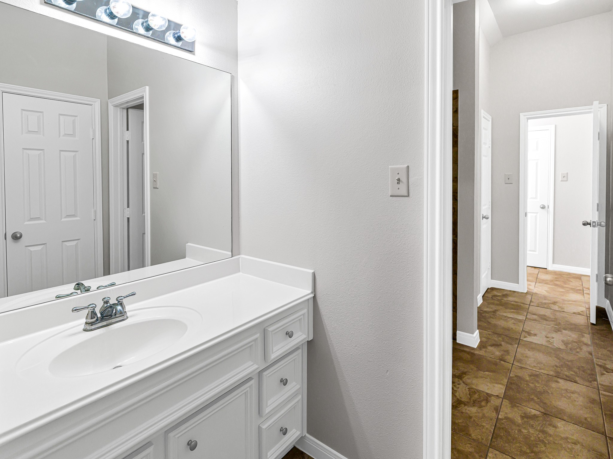 2714 Misty River Lane Richmond, TX 77406 - Photo 35 of 50 a bathroom with a sink and a mirror