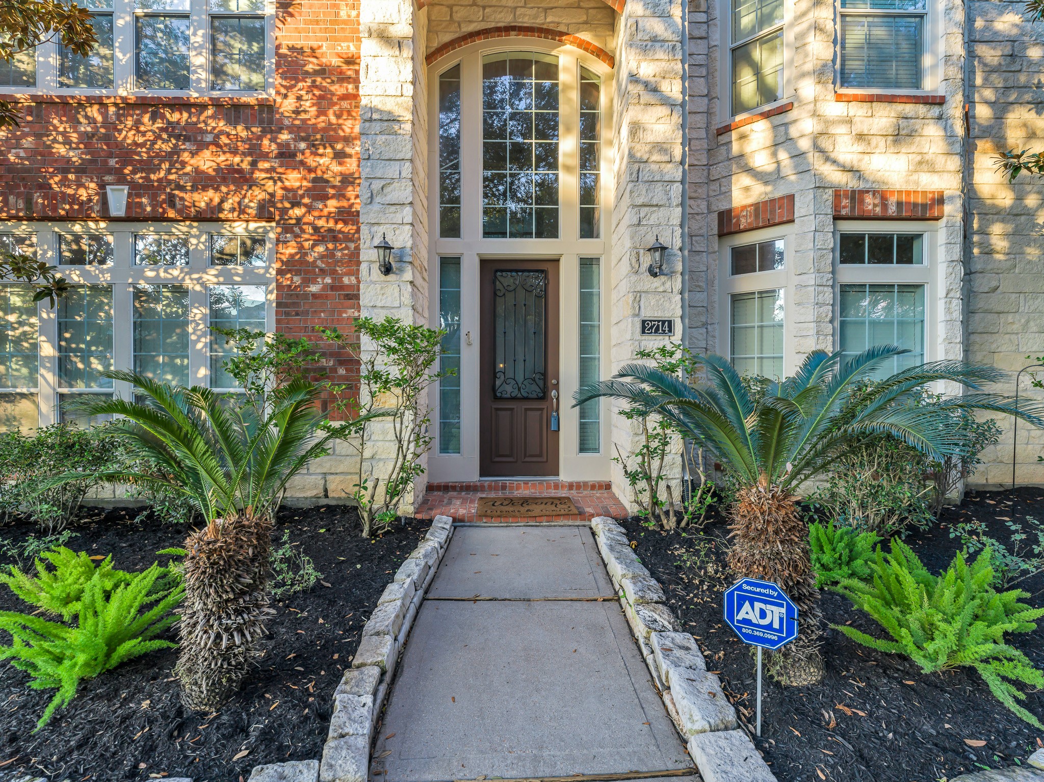 2714 Misty River Lane Richmond, TX 77406 - Photo 4 of 50 a view of a brick building next to a yard