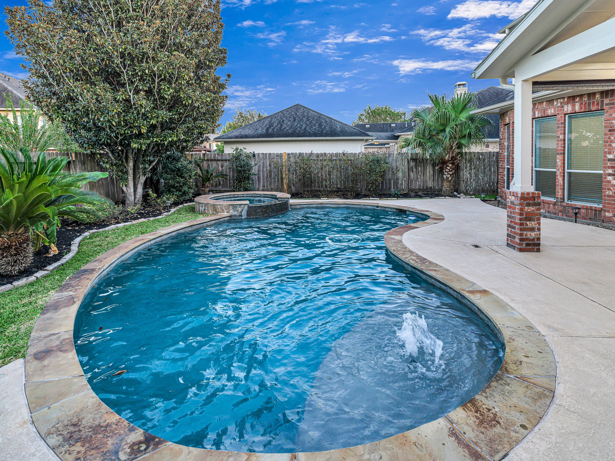 2714 Misty River Lane Richmond, TX 77406 - Photo 45 of 50 a view of a swimming pool with a patio
