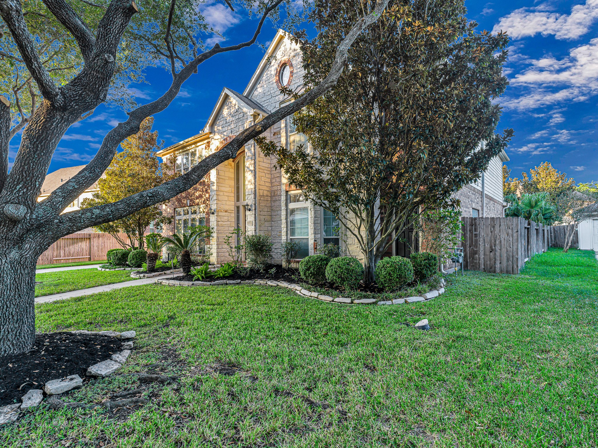 2714 Misty River Lane Richmond, TX 77406 - Photo 50 of 50 a view of a house with a big yard and large trees