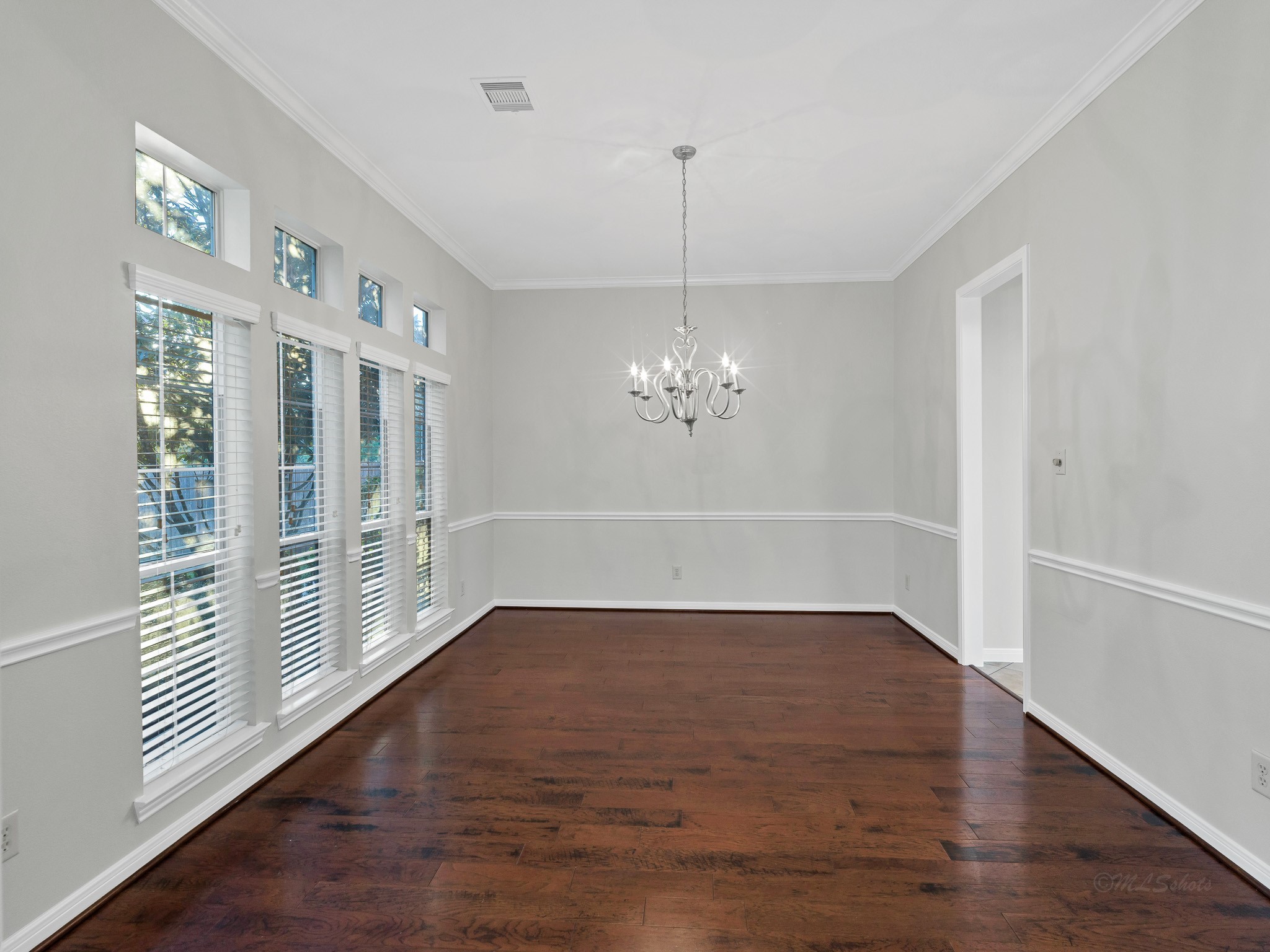 2714 Misty River Lane Richmond, TX 77406 - Photo 10 of 50 a view of empty room with wooden floor and fan