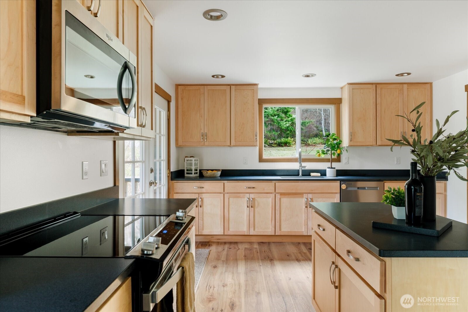 2341 Libbey Road Coupeville, WA 98239 - Photo 11 of 36 a kitchen with a sink stove and microwave