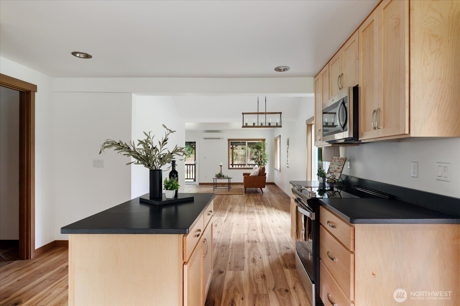 2341 Libbey Road Coupeville, WA 98239 - Photo 13 of 36 a kitchen with a counter top space a sink and cabinets
