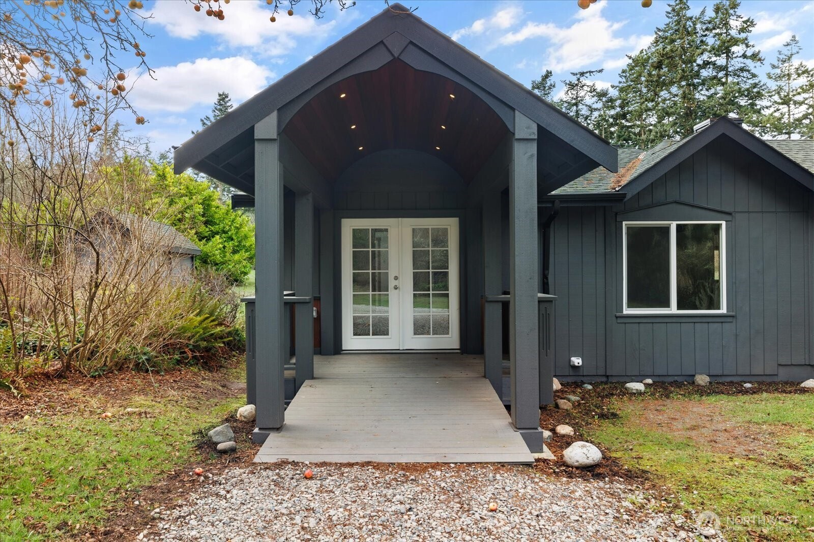 2341 Libbey Road Coupeville, WA 98239 - Photo 4 of 36 a view of a house with backyard tub and trees