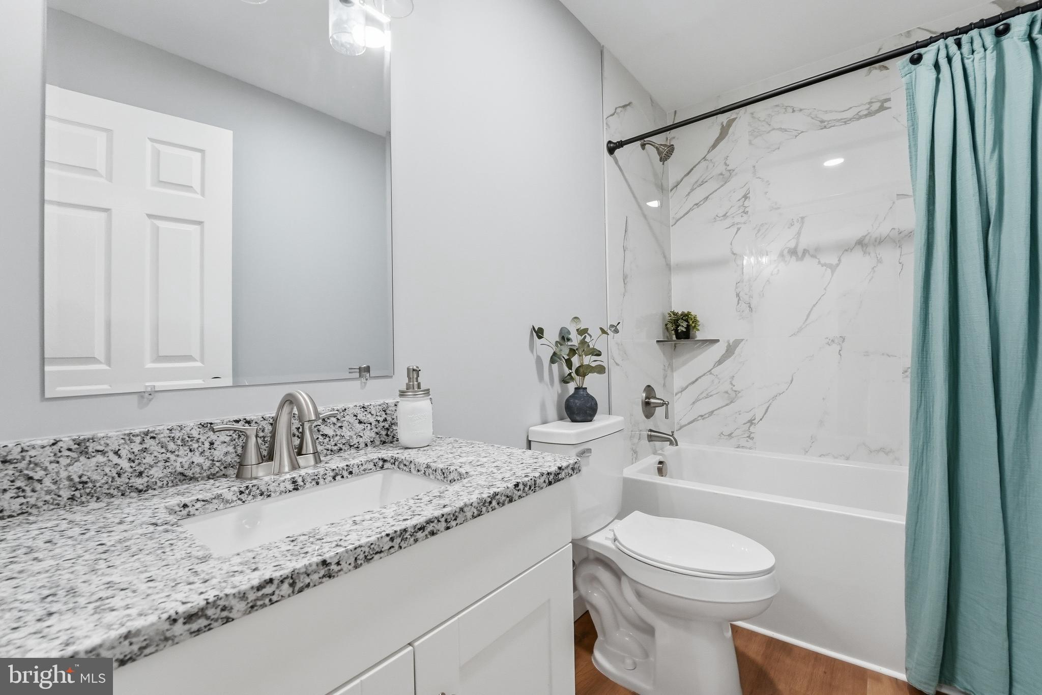 2974 Novum Road Reva, VA 22735 - Photo 29 of 44 a bathroom with a granite countertop sink toilet and shower