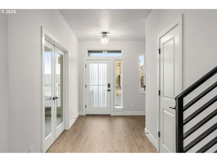 a view of entryway with wooden floor