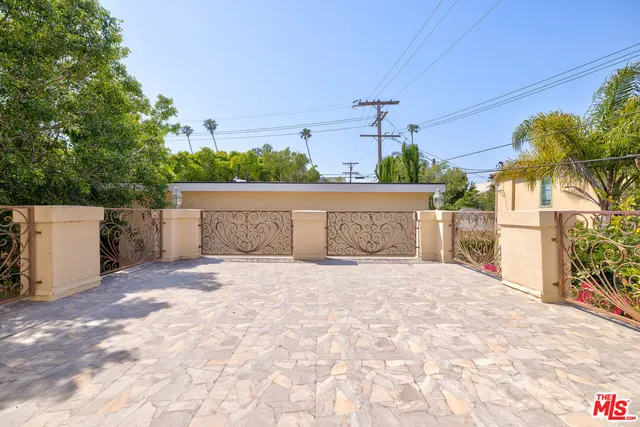 a view of backyard with deck and outdoor seating