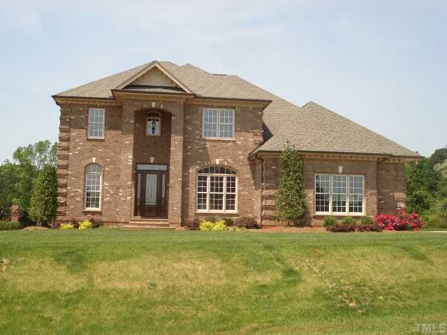 3308 Cotten Road, Unit LOT85 Raleigh, NC 27603 - Photo 1 of 12 front view of a brick house with a yard