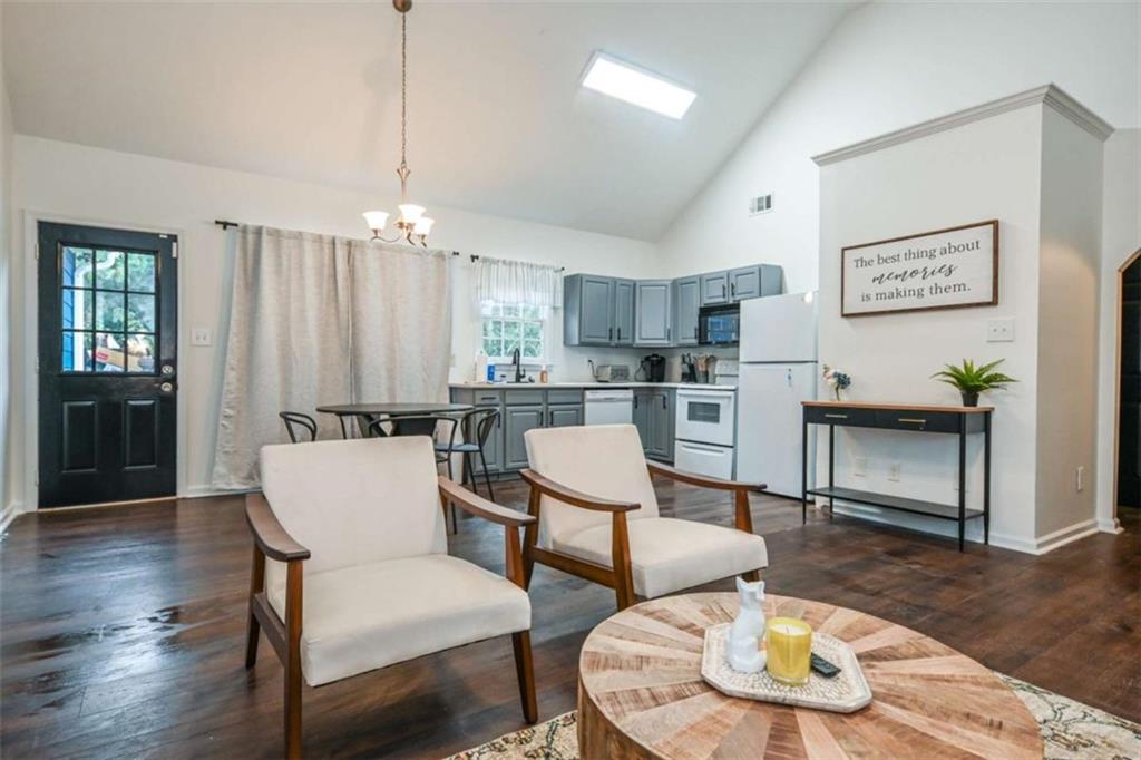 398 Arch Street Athens, GA 30601 - Photo 14 of 27 a living room with furniture kitchen view and a chandelier