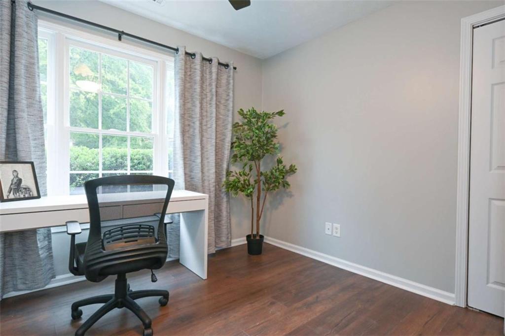 398 Arch Street Athens, GA 30601 - Photo 21 of 27 a view of a workspace with furniture and a window