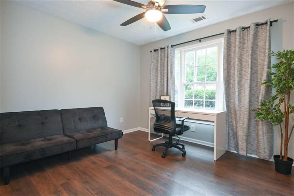 398 Arch Street Athens, GA 30601 - Photo 22 of 27 a living room with furniture and a large window