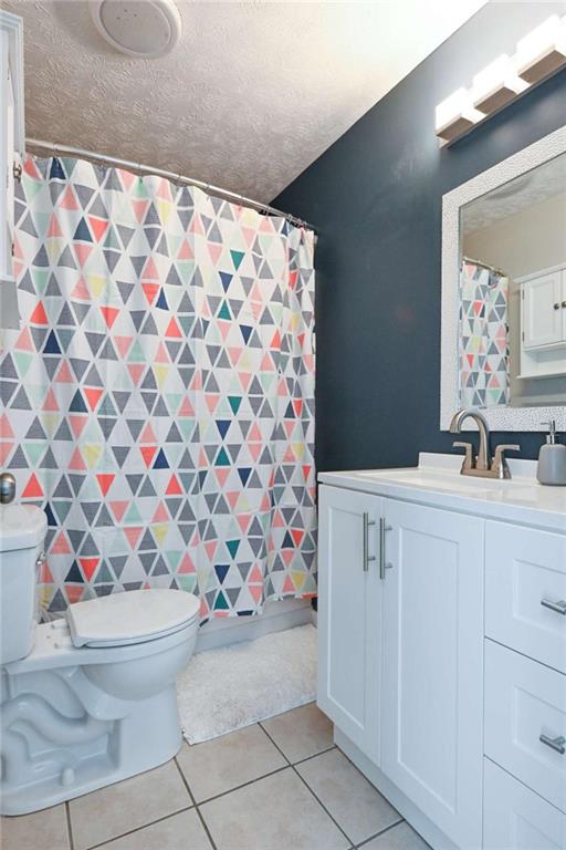 398 Arch Street Athens, GA 30601 - Photo 23 of 27 a bathroom with a sink toilet and shower