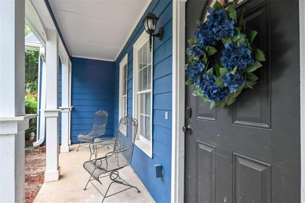 398 Arch Street Athens, GA 30601 - Photo 4 of 27 a view of entryway with wooden floor and a potted plant