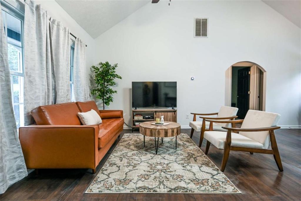 398 Arch Street Athens, GA 30601 - Photo 7 of 27 a living room with a couch and a flat screen tv