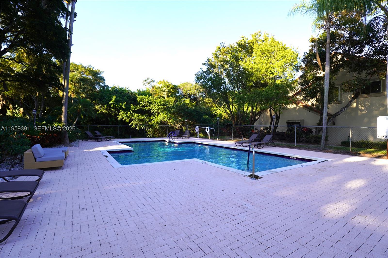 5741 Coach House Circle, Unit H Boca Raton, FL 33486 - Photo 34 of 34 a view of a swimming pool with a patio