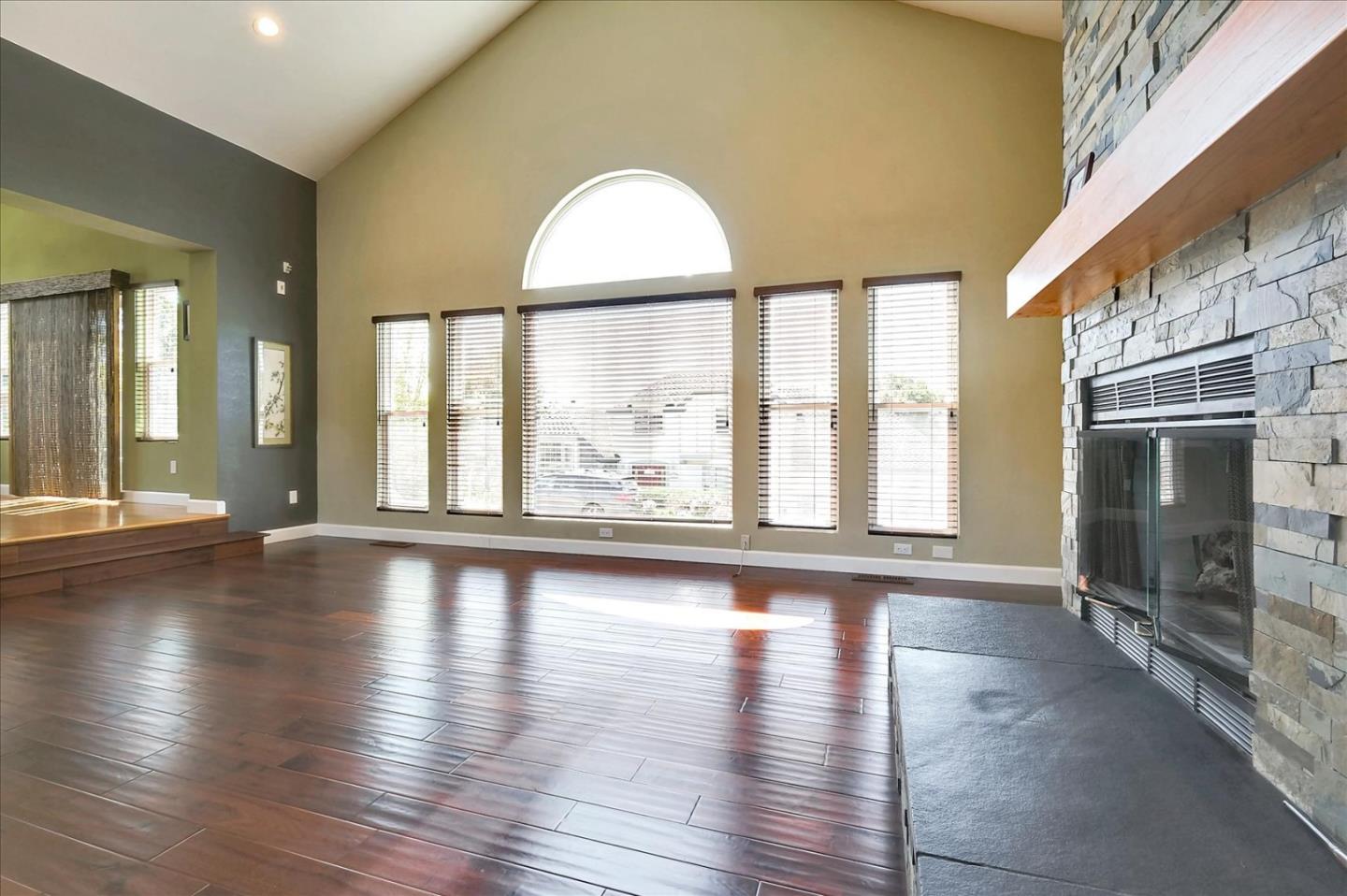 7128 Danko Drive Aptos, CA 95003 - Photo 12 of 47 a view of an empty room with wooden floor and a window