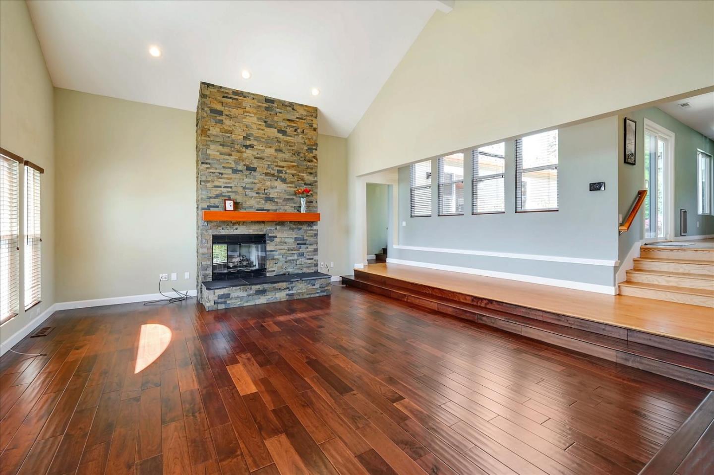 7128 Danko Drive Aptos, CA 95003 - Photo 13 of 47 a view of a livingroom with wooden floor and a fireplace