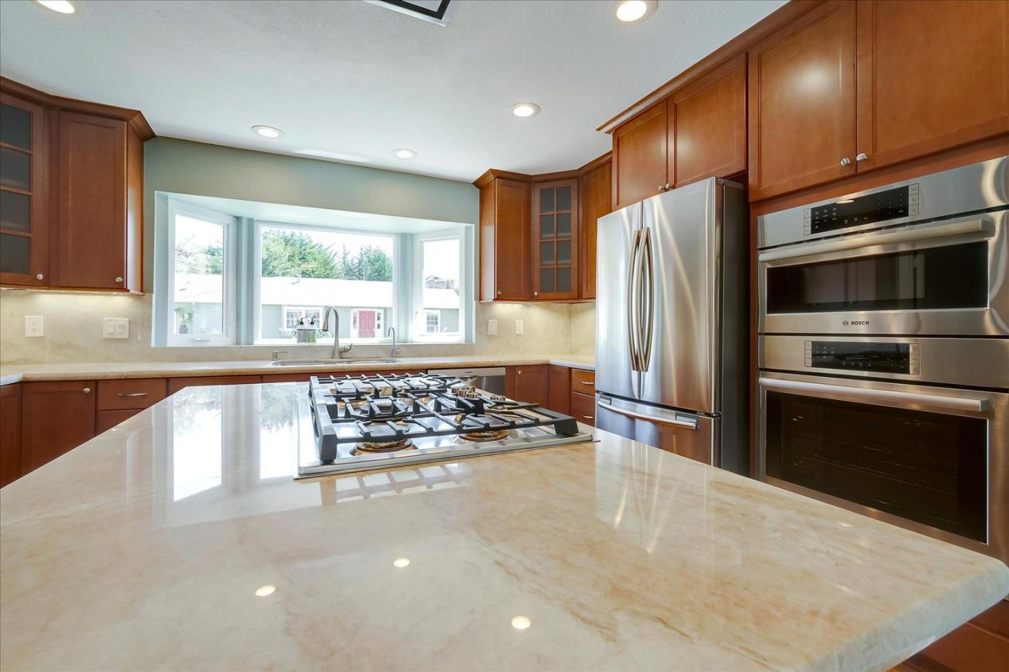 7128 Danko Drive Aptos, CA 95003 - Photo 17 of 47 a kitchen with stainless steel appliances granite countertop a refrigerator stove and sink