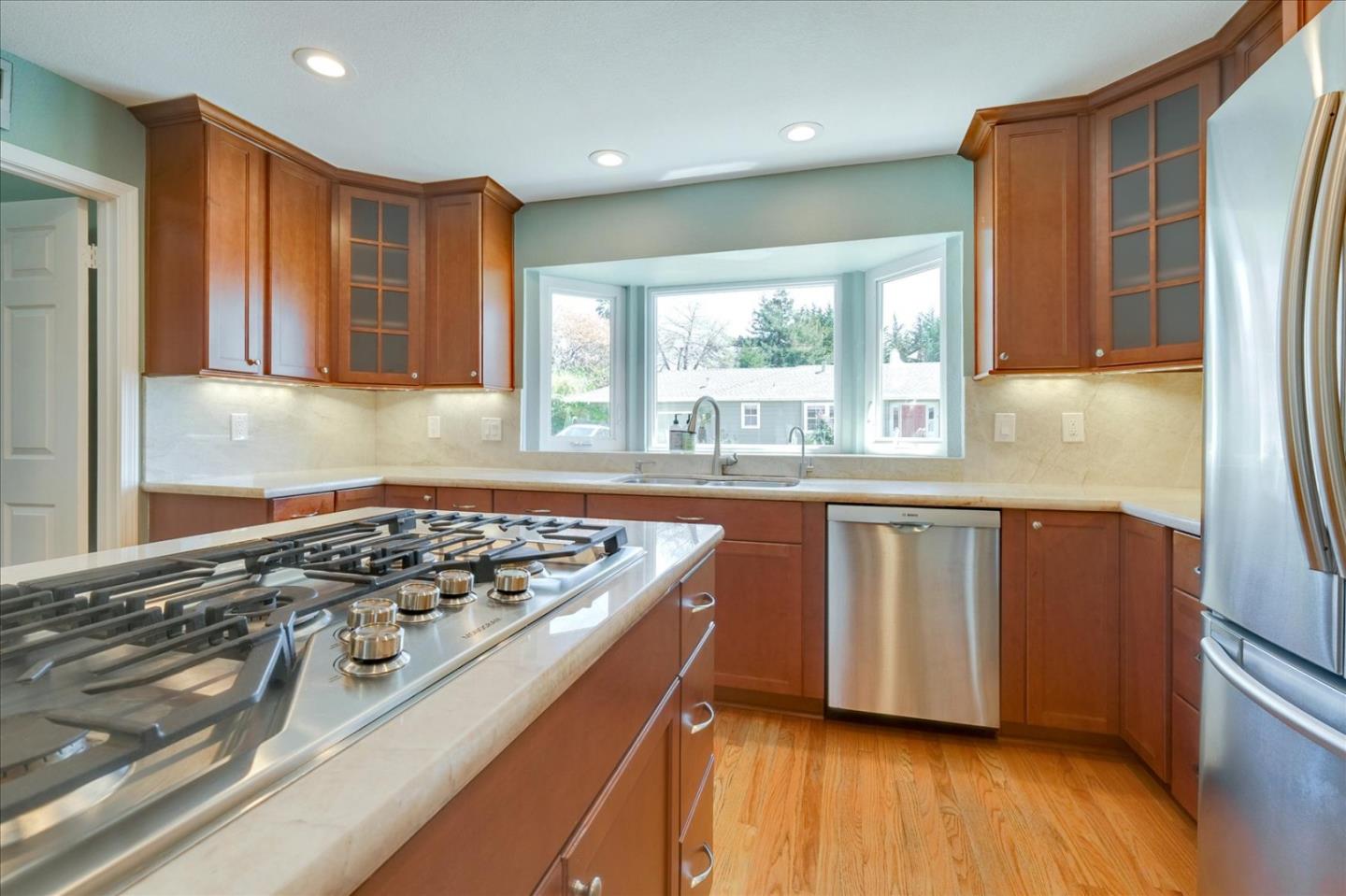 7128 Danko Drive Aptos, CA 95003 - Photo 18 of 47 a kitchen with stainless steel appliances granite countertop a stove a sink and a refrigerator