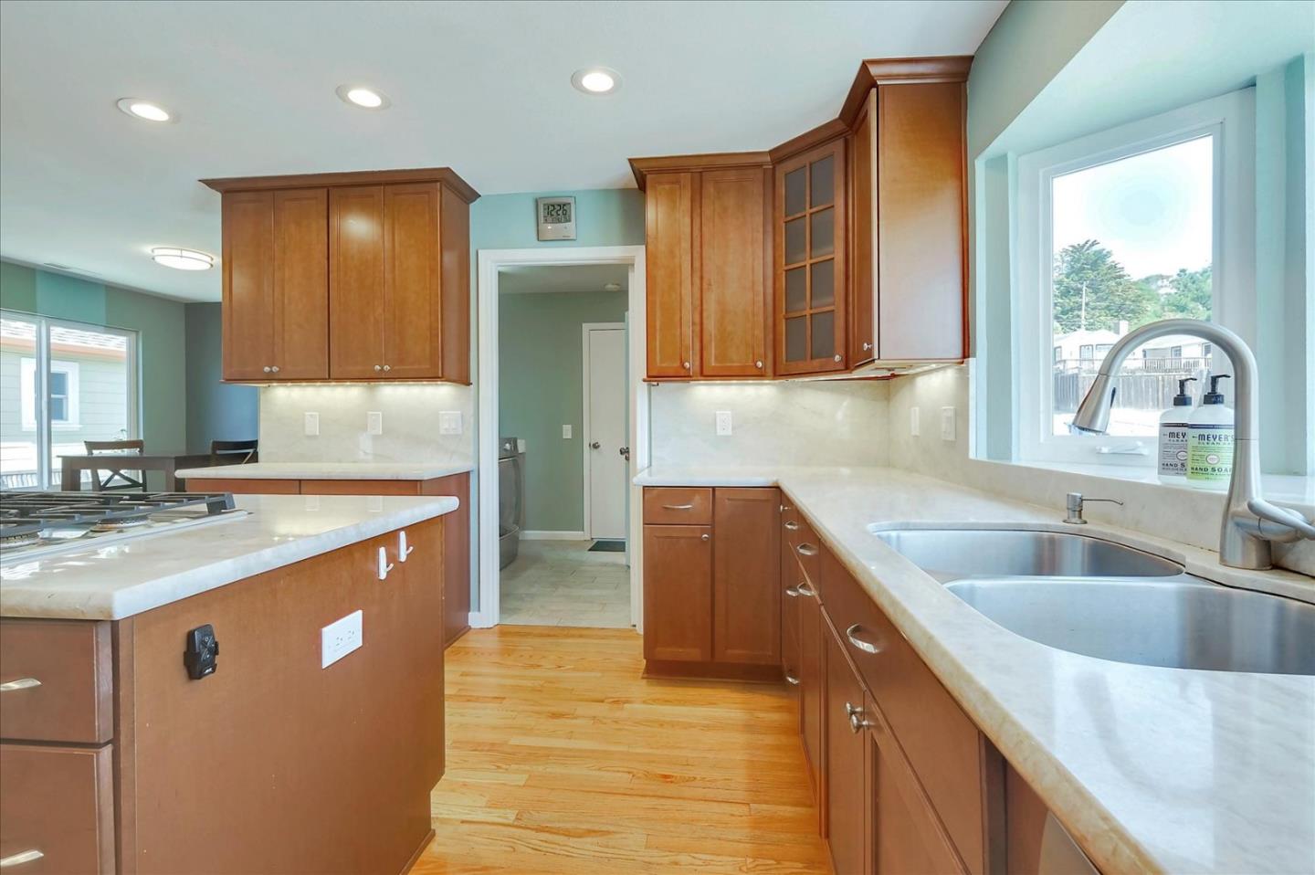 7128 Danko Drive Aptos, CA 95003 - Photo 20 of 47 a kitchen with kitchen island granite countertop a sink and counter space
