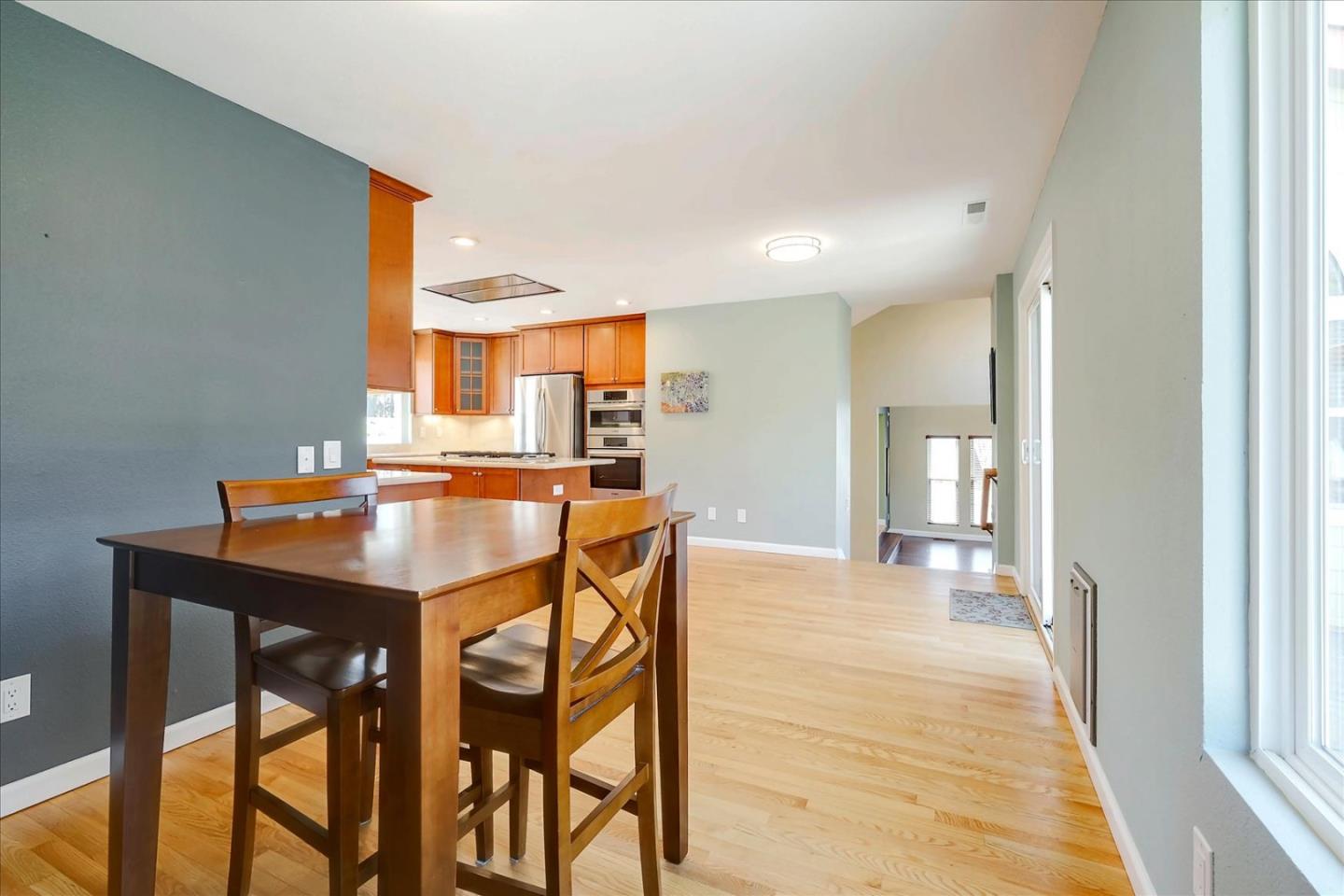 7128 Danko Drive Aptos, CA 95003 - Photo 22 of 47 a view of a kitchen and dining table