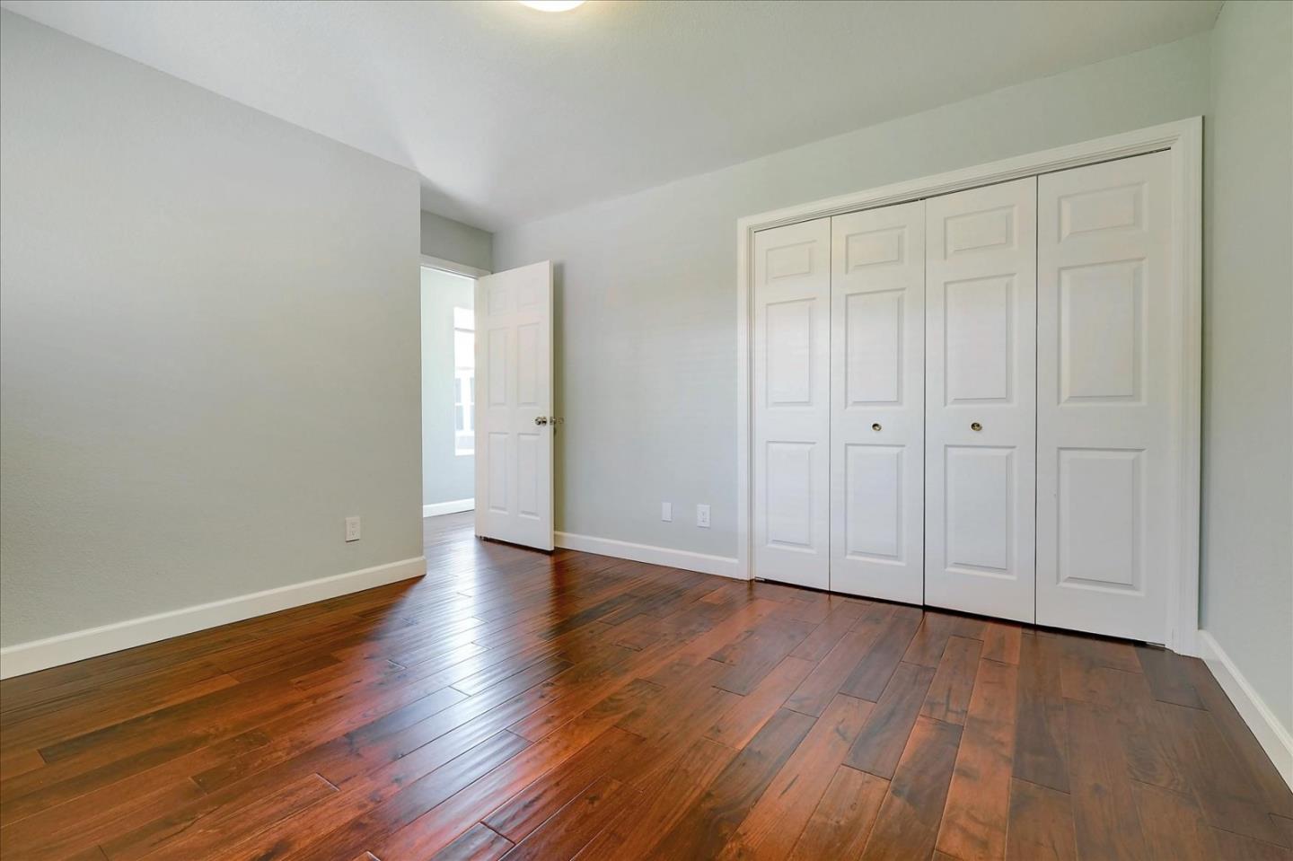 7128 Danko Drive Aptos, CA 95003 - Photo 26 of 47 a view of an empty room with wooden floor