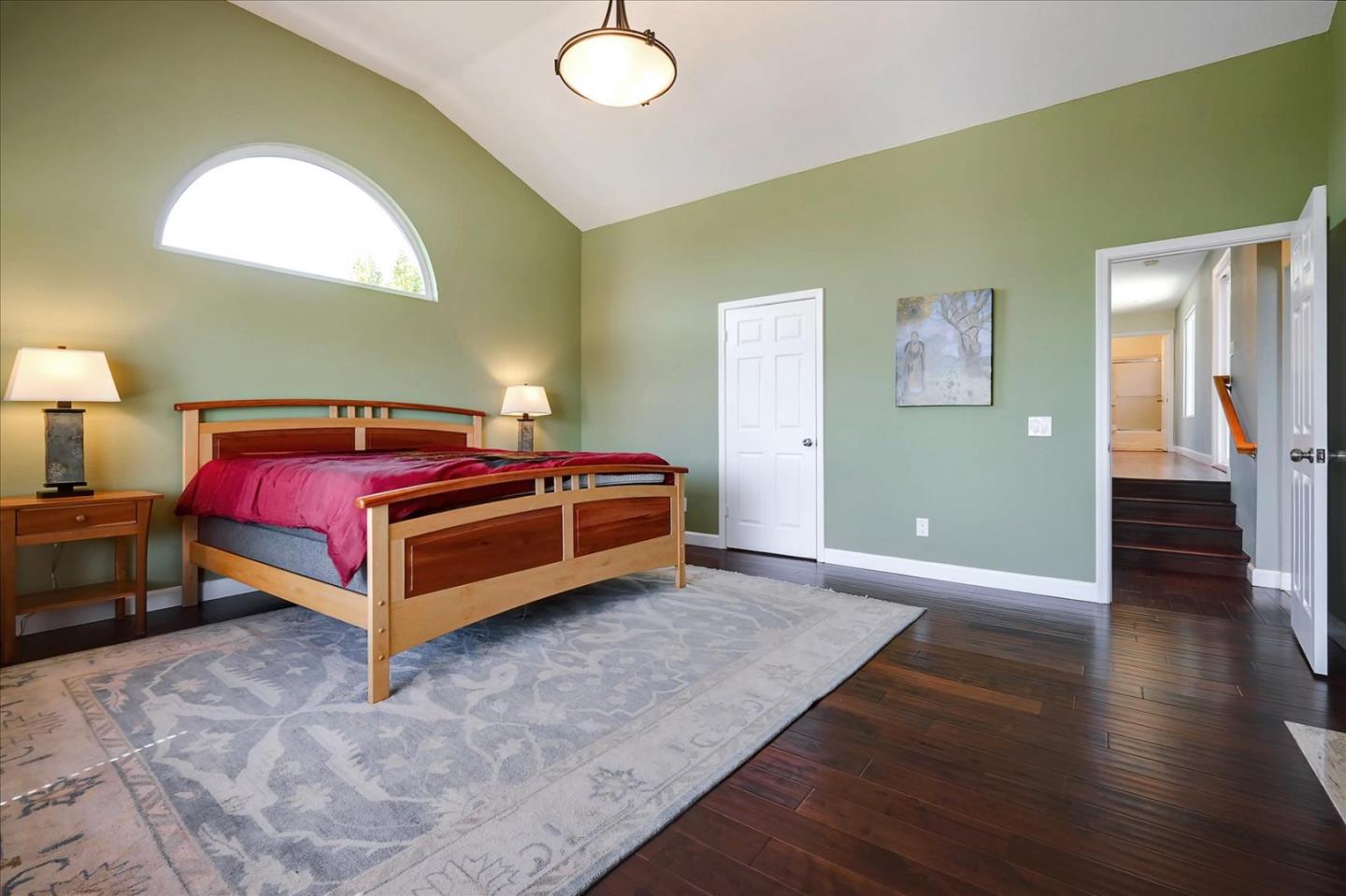 7128 Danko Drive Aptos, CA 95003 - Photo 28 of 47 a bedroom with a bed and wooden floor