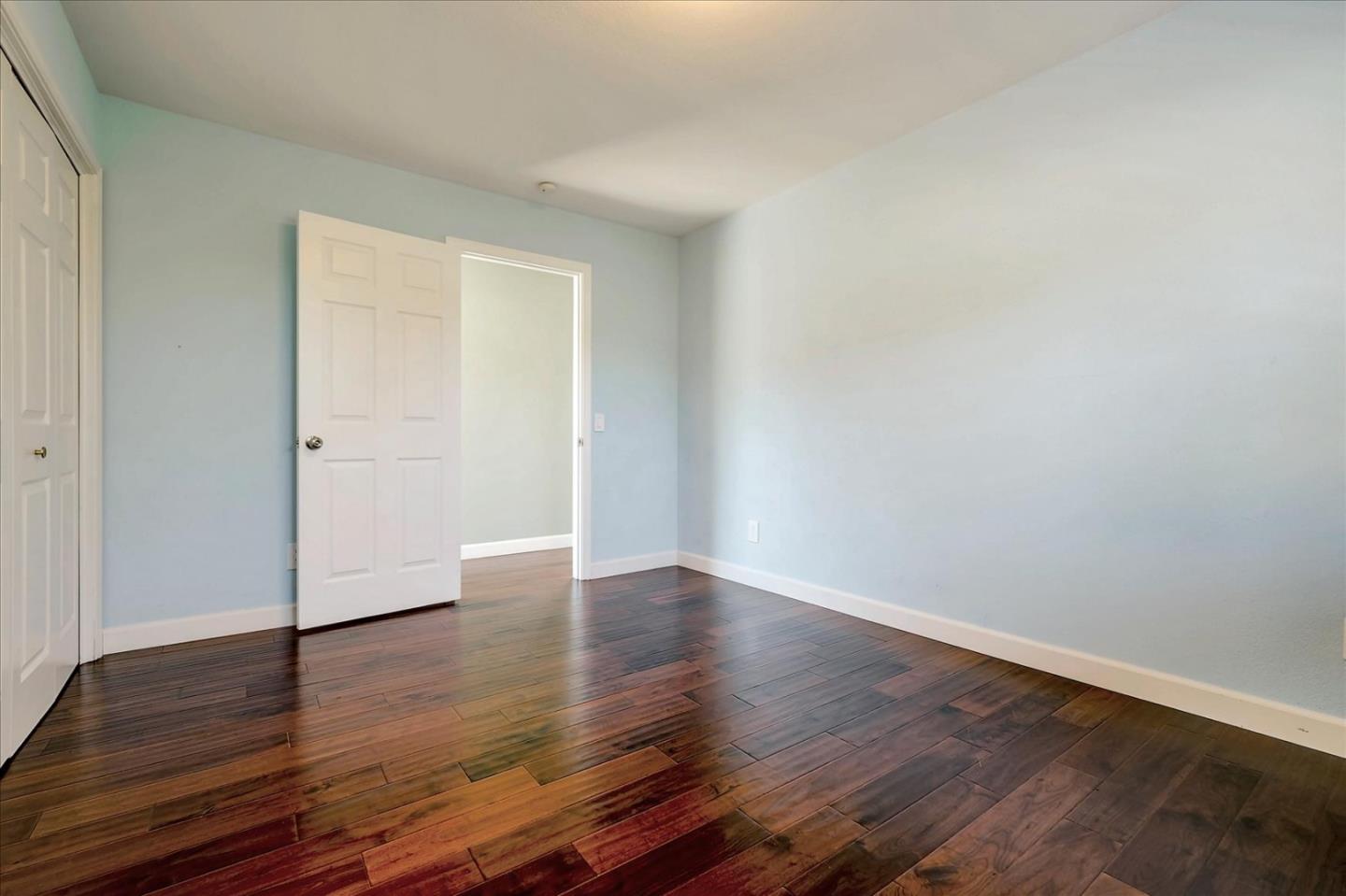 7128 Danko Drive Aptos, CA 95003 - Photo 32 of 47 a view of an empty room with wooden floor