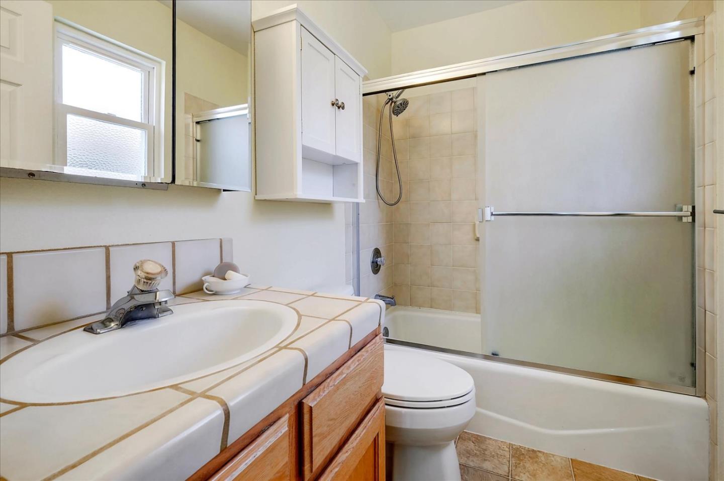 7128 Danko Drive Aptos, CA 95003 - Photo 34 of 47 a bathroom with a sink toilet and shower