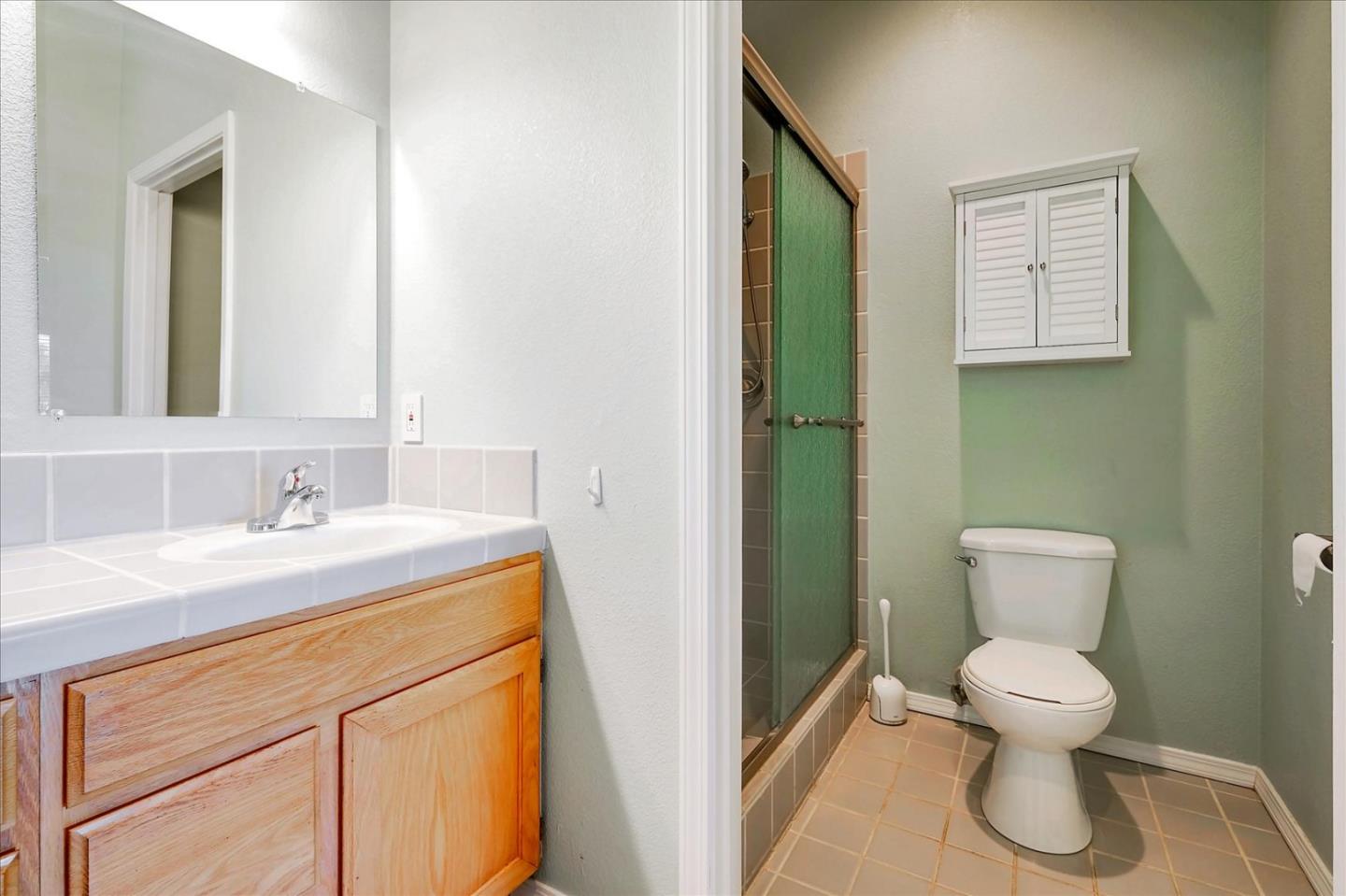 7128 Danko Drive Aptos, CA 95003 - Photo 36 of 47 a bathroom with a toilet sink and mirror