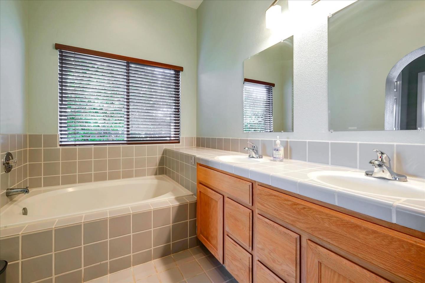 7128 Danko Drive Aptos, CA 95003 - Photo 37 of 47 a bathroom with a tub sink and mirror